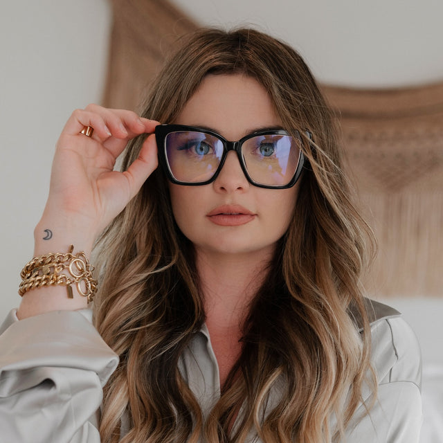 customer content - female wearing diff eyewear becky iv cat eye glasses with a black frame and prescription lenses brown hair