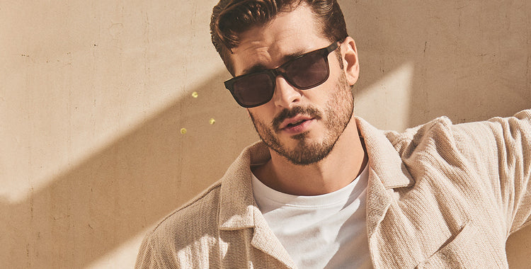 Male model in joshua tree wearing diff eyewear billie black with grey polarized lens sunglasses