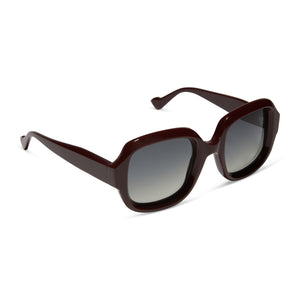 iconica featuring the gisele round sunglasses with a bordeaux frame and grey gradient polarized lenses angled view